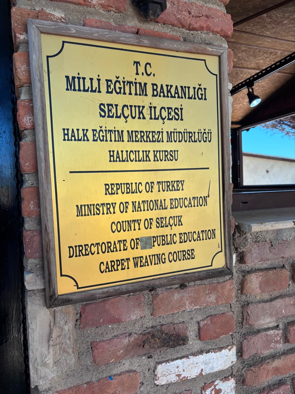 Official Turkish Ministry of Education carpet-weaving course sign