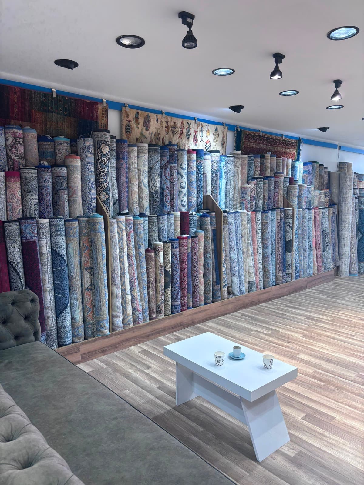 Stacks of hand-knotted Turkish rugs ready to be placed
