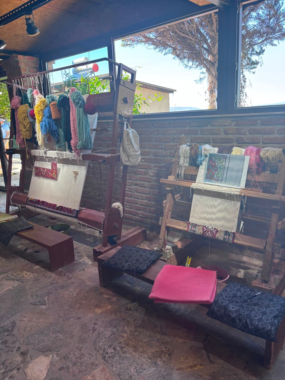 Turkish rugs being hand-knotted on traditional looms, strand by strand
